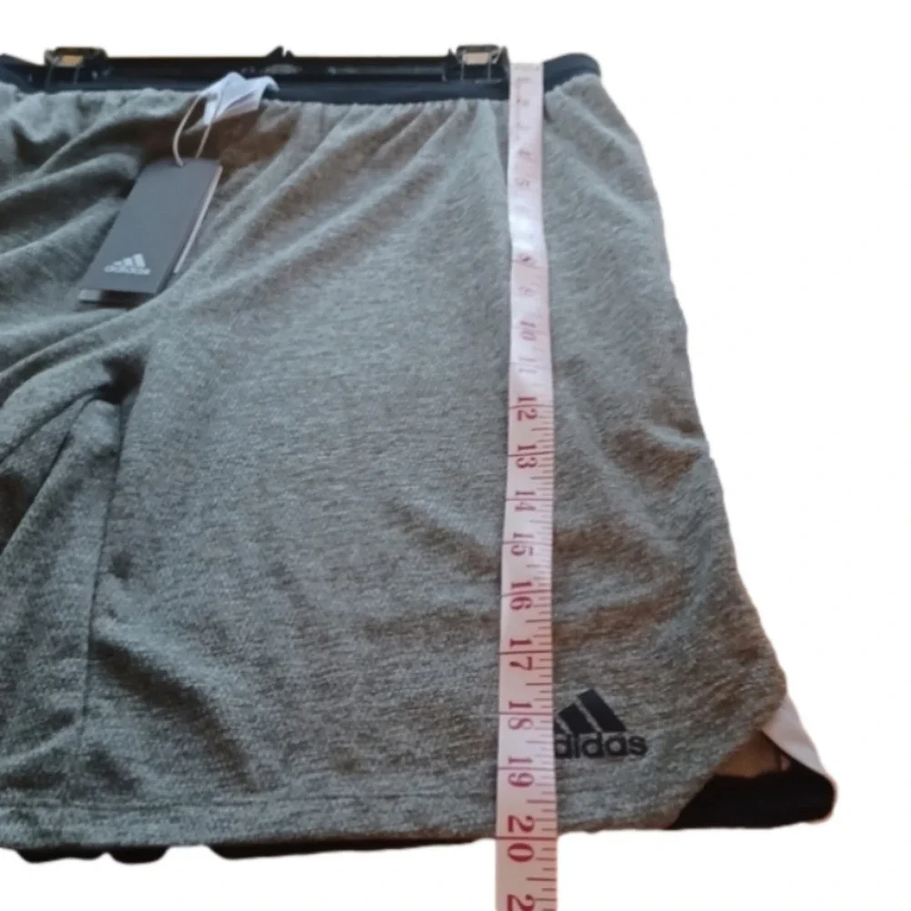 NWT   Adidas knit Grey shorts. Black waist band, white stripes. Size medium.